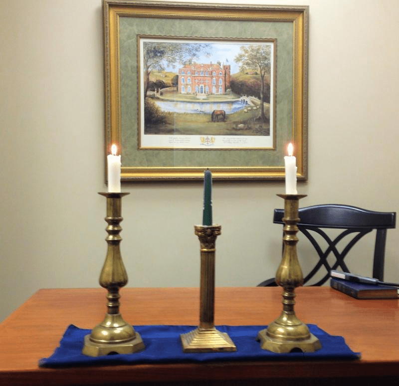 three candles arranged on nice candlestick holders